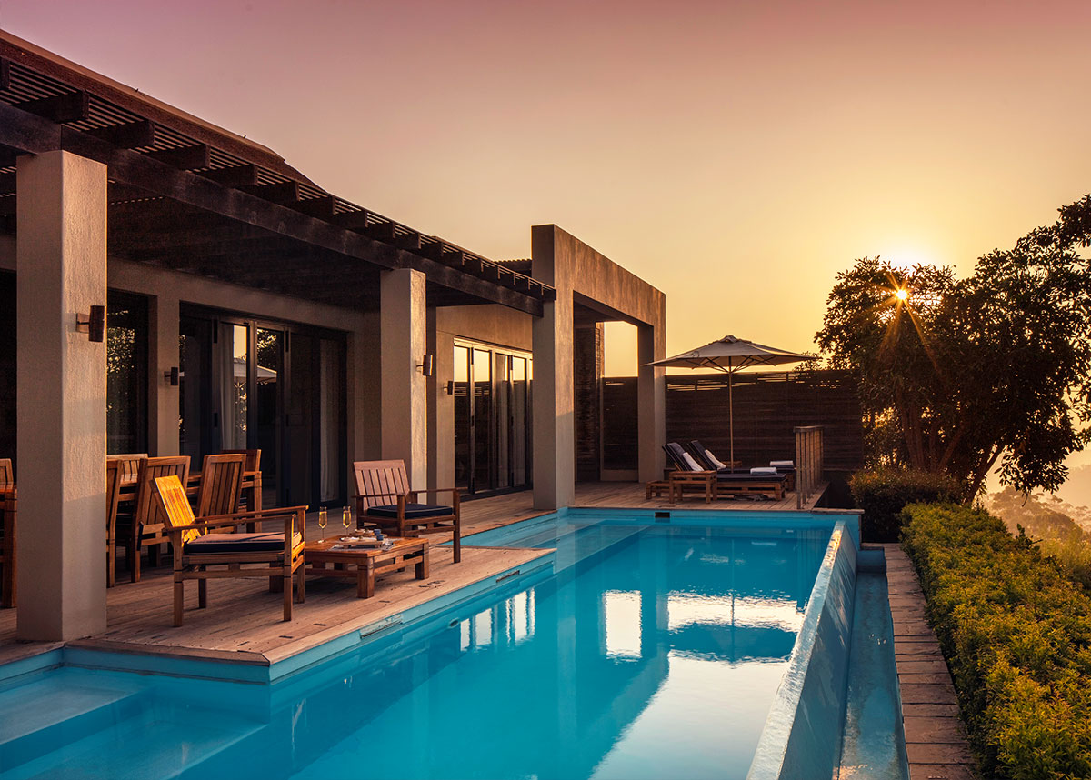 The terrace and pool of Presidential Lodge 2 at dusk