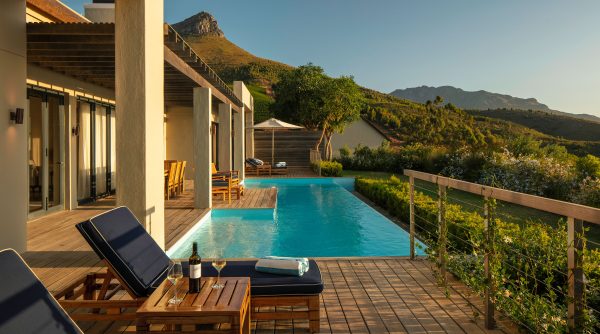 12m metre Presidential Lodge 1 pool and terrace overlooking mountains at Delaire Graff Estate in Stellenbosch South Africa