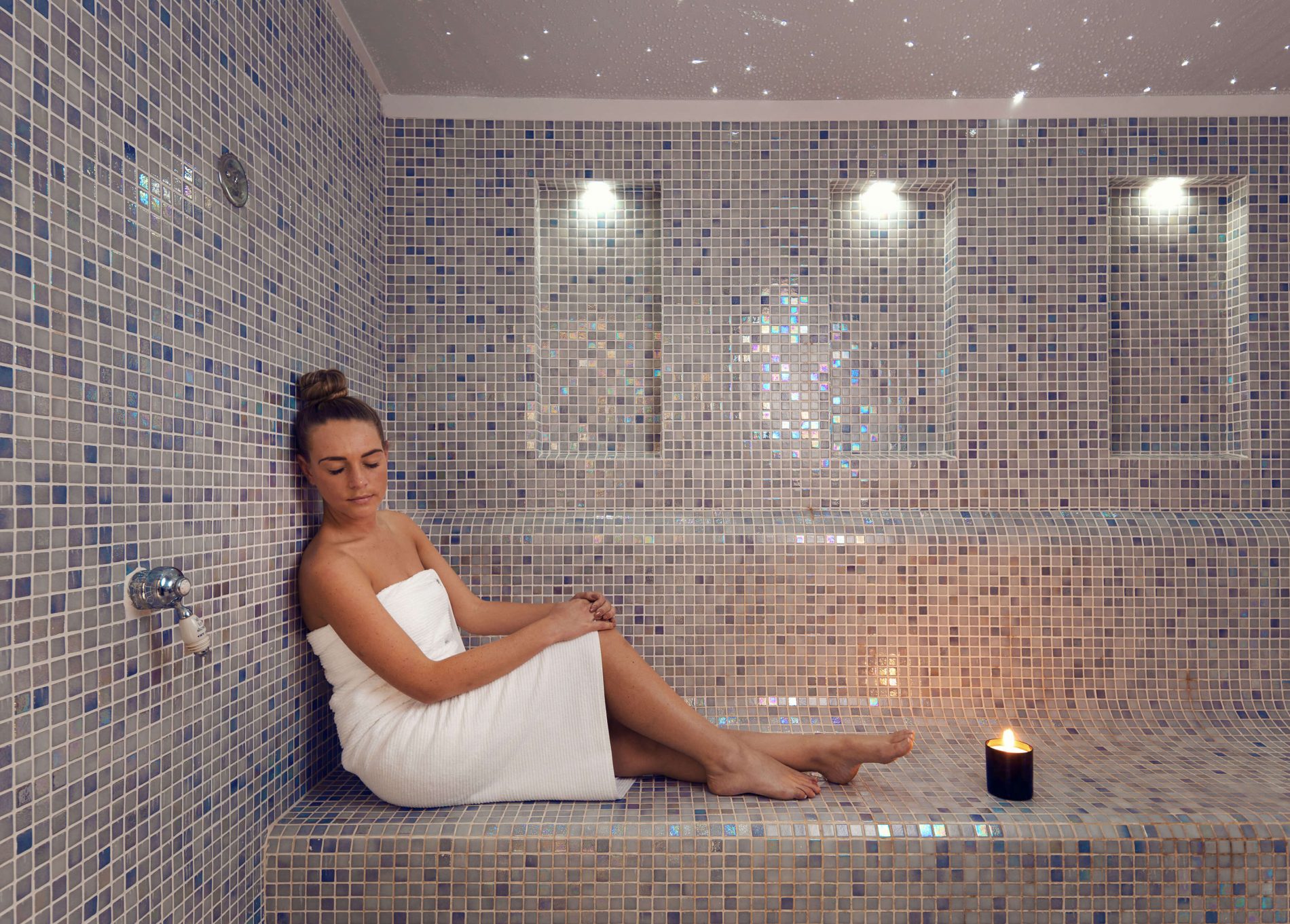 A lady relaxing in the steam room at Delaire Graff Estate Spa