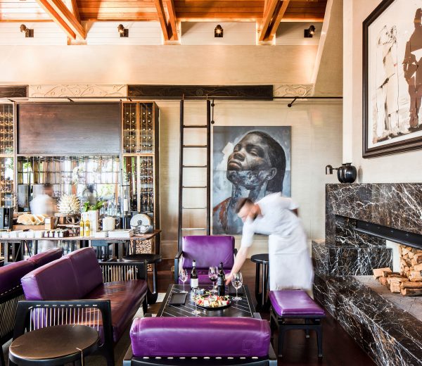 A waiter serving a tasting plate in the Wine Lounge at Delaire Graff Estate