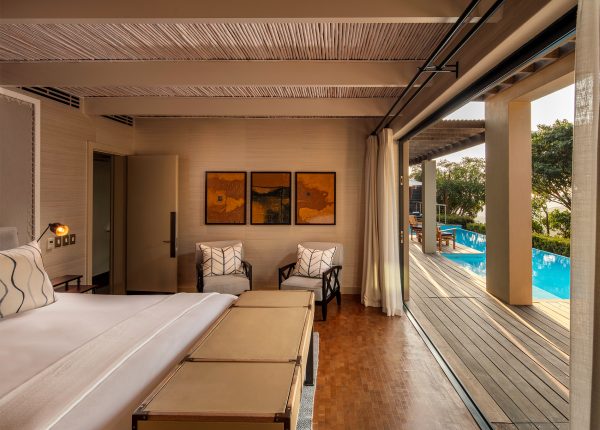 a king size bedroom leading to private 12 metre pool and terrace within the Presidential Lodge 2 at Delaire Graff Estate South Africa