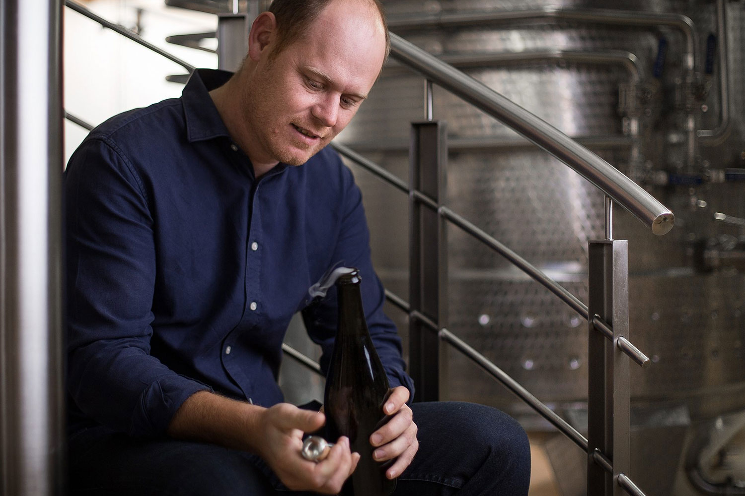 Morne Vrey sitting on Delaire Graff Estate winery steps