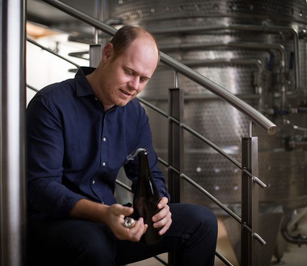 Delaire Graff Estate's Winemaker Morne Vrey seated in the Estate winery