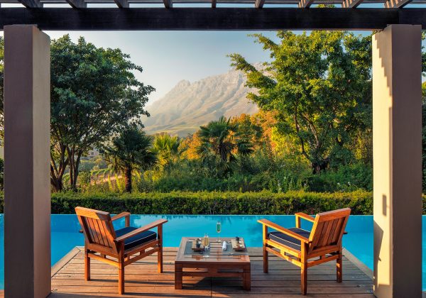 View from Presidential Lodge 2 terrace pool towards Simonsberg Mountain peak