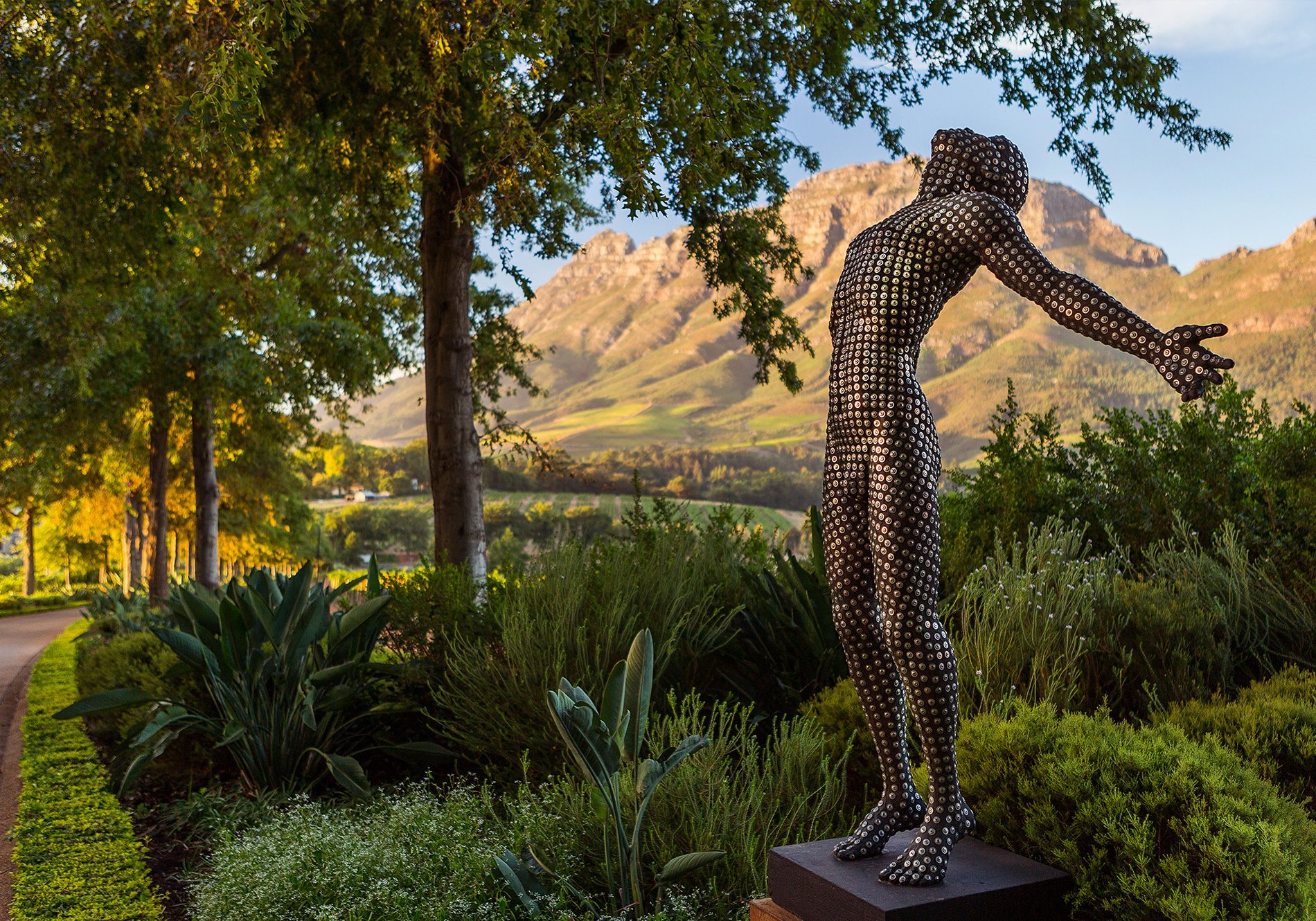 A Dylan Lewis human form sculpture in the gardens of Delaire Graff Estate