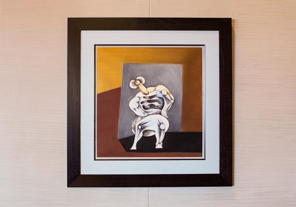 A Sydney Kumalo painting hanging on the wall of Delaire Graff Estate