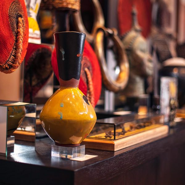 A yellow handcrafted vase on display at the Africa Nova boutique at Delaire Graff Estate