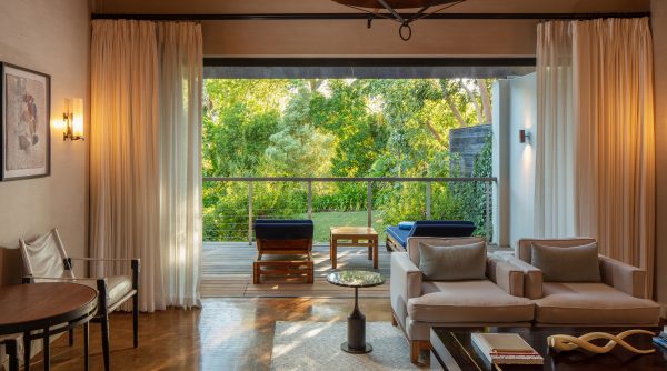 Deluxe Lodge living room and terrace overlooking gardens