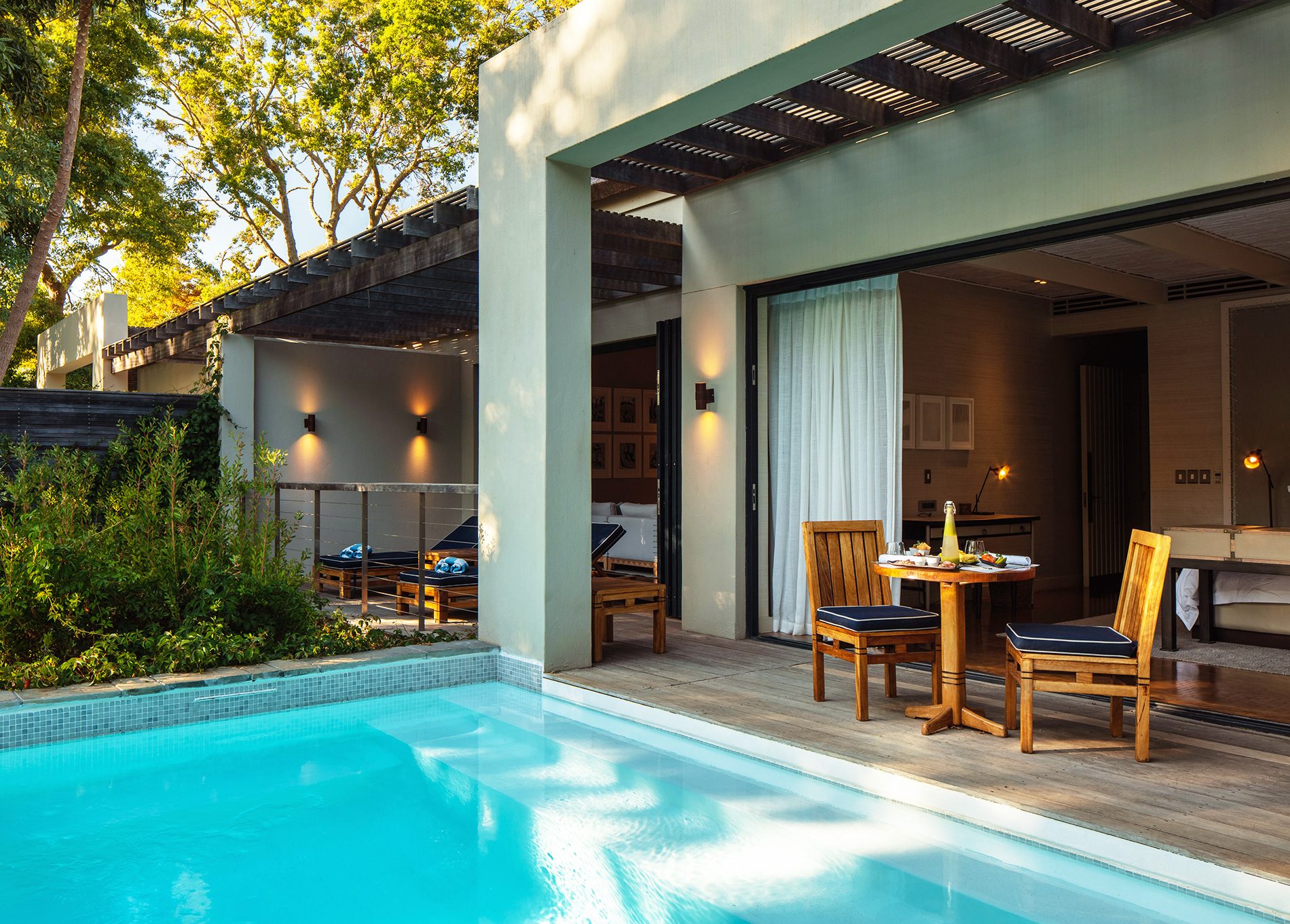 Deluxe Lodge plunge pool and terrace leading into living room and king size bedroom