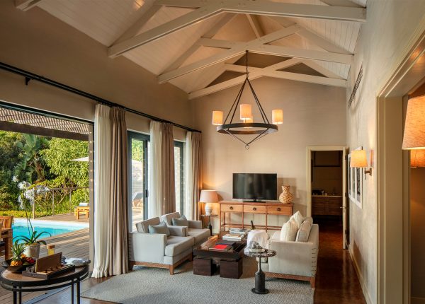 Presidential Lodge 2 living room leading onto private terrace and 12 metre swimming pool at Delaire Graff Estate Stellenbosch